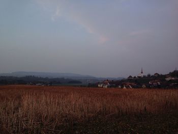 Scenic view of field against sky during sunset