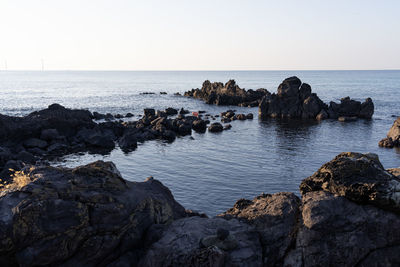 Scenic view of sea against clear sky