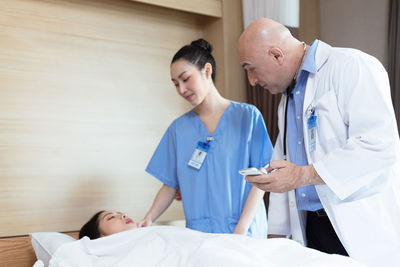 Doctor examining patient in hospital