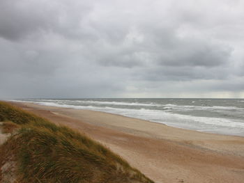 Scenic view of beach against sky