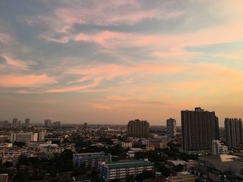 Cityscape against sky during sunset