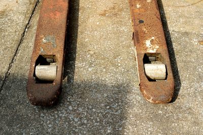 High angle view of rusty metal in floor