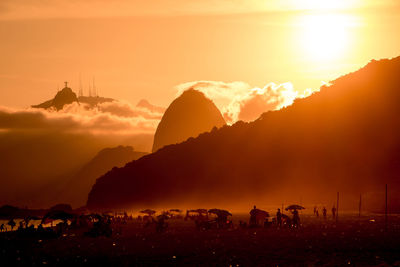 Silhouette of people at beach