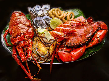 High angle view of fruits in plate on table