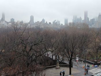 Scenic view of river in city during winter