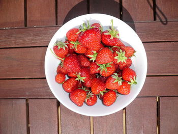 High angle view of strawberries in plate on table