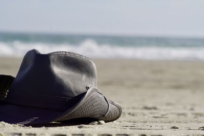 Rear view of woman wearing hat at beach