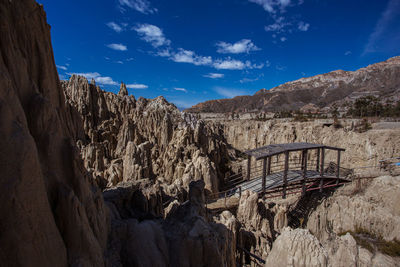 Panoramic view of mountains against blue sky