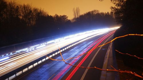 Light trails on road at night