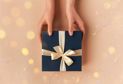 Low section of woman holding christmas presents