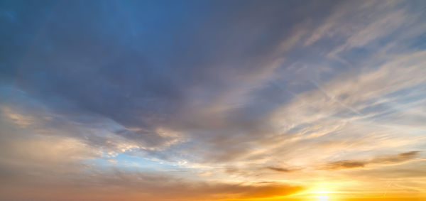 Low angle view of dramatic sky during sunset