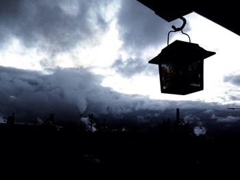 Built structure on landscape against cloudy sky