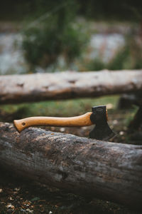 Close up of an axe. chopping firewood for a bonfire while camping in norway.