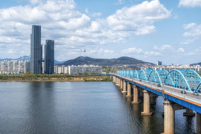 The view of namsan tower over the han river taken near dongjak bridge in seoul, south korea