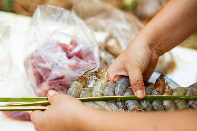 Midsection of person preparing food