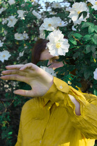 Close-up of woman hand with flowers