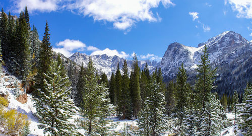 Scenic view of mountains against cloudy sky