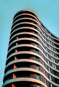 Low angle view of modern building against clear blue sky