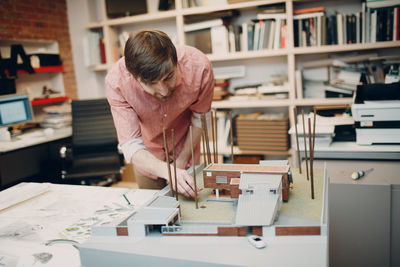 Woman working on table at home