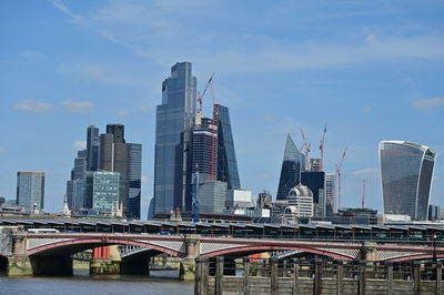 Modern buildings in city against sky