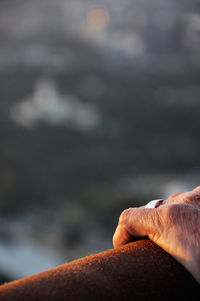 Close-up of hand on the beach