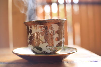 Close-up of tea cup on table