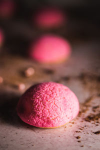Close-up of pink berries on table