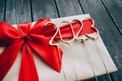 High angle view of red ribbon on table