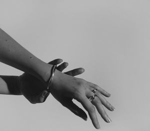 Close-up of woman hand over white background