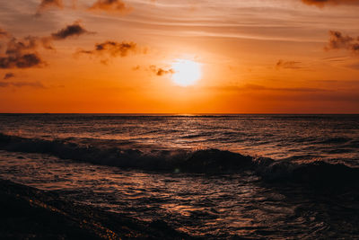 Amazing orange sunset on the indian ocean in bali island