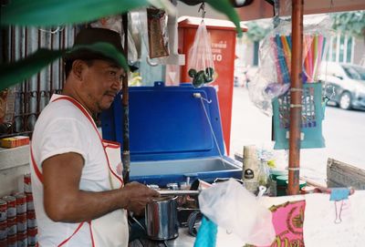 Man selling food in market