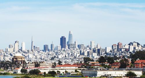 Modern buildings in city against sky