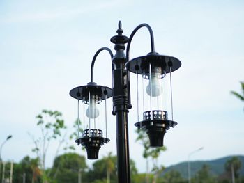 Low angle view of street light against sky