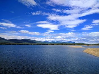 Scenic view of lake against blue sky