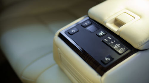 Close-up of control panel on vehicle seat