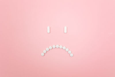 Directly above shot of pink painting on background