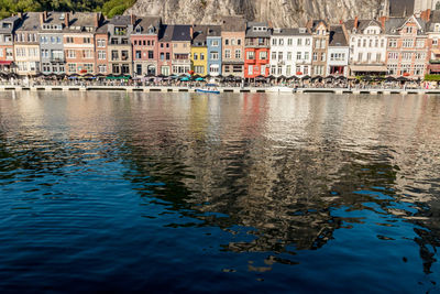 Riverside with colored houses in dinant in belgium