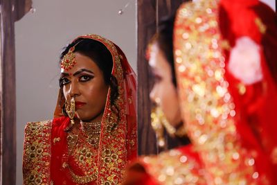 Portrait of beautiful young woman in traditional clothing