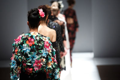 Rear view of models at fashion show
