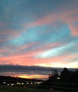 Scenic view of landscape against sky at sunset