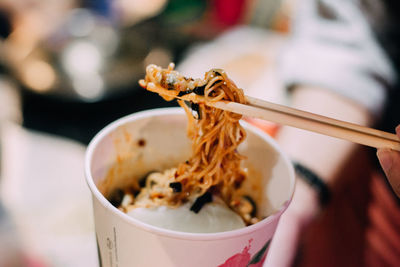 Close-up of hand holding ice cream