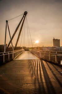 View of suspension bridge at sunset