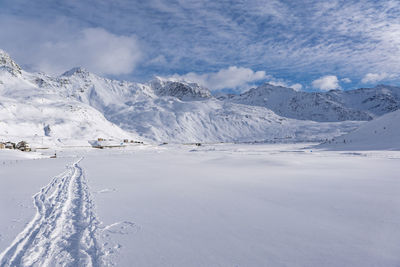 Scenic view of snowcapped mountains against sky