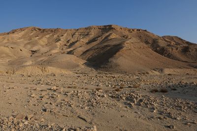 Scenic view of desert against clear sky