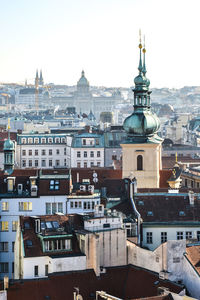 View of buildings in city against sky