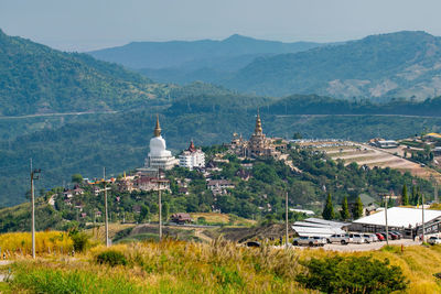 High angle view of buildings and mountain against sky