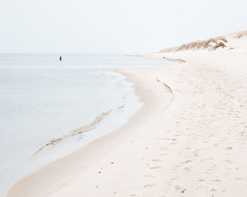 Scenic view of beach against clear sky