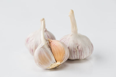 Close-up of garlic against white background