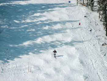 High angle view of people skiing on snow