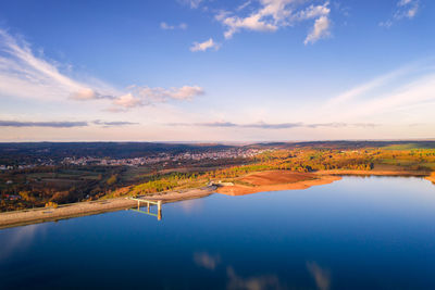Drone aerial panoramic view of sabugal dam lake reservoir with perfect reflection, in portugal